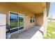 Covered patio area with grill and mini refrigerator for outdoor entertaining and relaxation at 733 Garden Oaks Sq, Seffner, FL 33584
