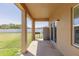 Spacious covered patio with room for outdoor dining, overlooking a large backyard at 733 Garden Oaks Sq, Seffner, FL 33584