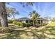 Spacious backyard featuring a lush lawn and well-maintained landscaping at 7472 Clearmeadow Dr, Spring Hill, FL 34606