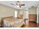 Inviting bedroom with wood floors and a ceiling fan at 7472 Clearmeadow Dr, Spring Hill, FL 34606