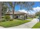 Charming community center with beautiful landscaping, stone accents, and a welcoming entrance at 7472 Clearmeadow Dr, Spring Hill, FL 34606