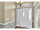 Bright entryway features a white front door with sidelights, leading into the home at 7472 Clearmeadow Dr, Spring Hill, FL 34606