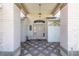 Covered entryway with brick columns and decorative accents leading to the home's front door at 7472 Clearmeadow Dr, Spring Hill, FL 34606