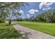 Picturesque golf course view with lush green fairways and mature trees under a sunny sky at 7472 Clearmeadow Dr, Spring Hill, FL 34606