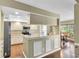 Modern kitchen with stainless steel appliances, granite countertops, and stylish cabinets at 7472 Clearmeadow Dr, Spring Hill, FL 34606