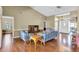 Open living room boasts vaulted ceilings, hardwood floors, and a seamless transition to other living spaces at 7472 Clearmeadow Dr, Spring Hill, FL 34606
