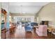 Expansive living area with hardwood floors, comfortable seating, and views of the outdoor patio at 7472 Clearmeadow Dr, Spring Hill, FL 34606