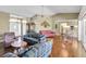 Spacious living room showcases an open layout, vaulted ceilings, and access to a dining area at 7472 Clearmeadow Dr, Spring Hill, FL 34606