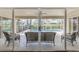 Covered patio with comfortable wicker furniture overlooking the private pool at 7472 Clearmeadow Dr, Spring Hill, FL 34606