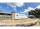Timber Pines Wellness Center sign surrounded by landscaping at 7472 Clearmeadow Dr, Spring Hill, FL 34606