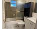 Bathroom featuring tub/shower combo and vanity sink with cabinet at 9741 Scenic Dr, Port Richey, FL 34668