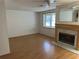 View of living room featuring hardwood floors and fireplace at 9741 Scenic Dr, Port Richey, FL 34668
