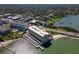 Aerial view of waterfront condo complex with parking and water access at 100 Bluff View Dr # 409C, Belleair Bluffs, FL 33770