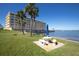 Beautiful view of the condo exterior showing manicured landscaping and stunning waterfront views at 100 Bluff View Dr # 409C, Belleair Bluffs, FL 33770