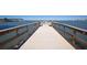 Dock with water views, benches, and wooden railings at 100 Bluff View Dr # 409C, Belleair Bluffs, FL 33770