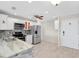 Modern kitchen features stainless steel appliances, light wood floors, and stylish backsplash at 100 Bluff View Dr # 409C, Belleair Bluffs, FL 33770