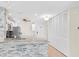 Modern kitchen features stainless steel appliances, light wood floors, and stylish backsplash at 100 Bluff View Dr # 409C, Belleair Bluffs, FL 33770
