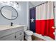 Bathroom with single sink vanity, modern fixtures, and neutral wall paint at 11009 Silver Dancer Dr, Riverview, FL 33579