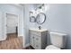 Bathroom with single sink vanity, modern fixtures, and neutral wall paint at 11009 Silver Dancer Dr, Riverview, FL 33579