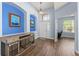 Bright foyer with high ceilings, art niches, and a view to the front door at 11009 Silver Dancer Dr, Riverview, FL 33579
