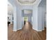Hallway featuring wood-look floors and neutral wall paint at 11009 Silver Dancer Dr, Riverview, FL 33579