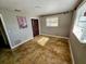 Bedroom with a window bringing in natural light, a ceiling fan, and a closet for storage at 11488 Short Ave, Largo, FL 33774