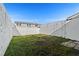 View of the backyard and the surrounding fence at 11918 Dietz Dr # 28, Tampa, FL 33626
