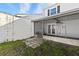 View of the enclosed patio with backyard access from the home at 11918 Dietz Dr # 28, Tampa, FL 33626
