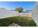 View of the backyard and the surrounding fence, with some greenery at 11918 Dietz Dr # 28, Tampa, FL 33626