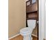 Efficient half-bathroom with a toilet and storage at 11918 Dietz Dr # 28, Tampa, FL 33626