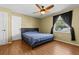 Bedroom with blue bed, ceiling fan, and a bright window at 11918 Dietz Dr # 28, Tampa, FL 33626