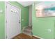 Welcoming entryway featuring a white door, hardwood floors, and stairs at 11918 Dietz Dr # 28, Tampa, FL 33626