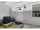 Side of the home with entry door, AC unit, and neatly landscaped walkway at 11918 Dietz Dr # 28, Tampa, FL 33626