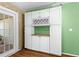 Kitchen cabinet storage with a beautiful wine wrack on the upper part of the unit at 11918 Dietz Dr # 28, Tampa, FL 33626