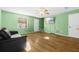 Inviting living room with wood floors, bright window, ceiling fan, and a cozy atmosphere at 11918 Dietz Dr # 28, Tampa, FL 33626
