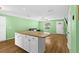 Bright living room with open floor plan, wood flooring, and view of kitchen at 11918 Dietz Dr # 28, Tampa, FL 33626