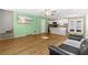 Open-concept living area with hardwood floors, stairs, and easy kitchen access at 11918 Dietz Dr # 28, Tampa, FL 33626