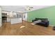 Spacious living space with hardwood floors, ceiling fans, and kitchen access at 11918 Dietz Dr # 28, Tampa, FL 33626