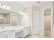 Bright bathroom boasts a double vanity, soaking tub, and glass shower at 12817 Daleridge Pl, Riverview, FL 33579