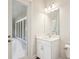 Bright bathroom showcasing a vanity with ample counter space and access to an enclosed outdoor patio at 12817 Daleridge Pl, Riverview, FL 33579