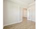 Bright room with wood-look floors and glass paneled double doors at 12817 Daleridge Pl, Riverview, FL 33579
