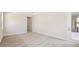 Spacious bedroom with neutral carpet and windows offering natural light and access to the porch at 12817 Daleridge Pl, Riverview, FL 33579