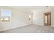 Spacious bedroom with neutral carpet and windows offering natural light and access to the hallway at 12817 Daleridge Pl, Riverview, FL 33579