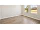 Bright room with wood-look floors and large windows offering plenty of natural light at 12817 Daleridge Pl, Riverview, FL 33579