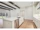 Open kitchen with an island, white cabinets, stainless-steel appliances, and modern lighting fixtures at 12817 Daleridge Pl, Riverview, FL 33579