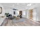 Bright living room with vaulted ceilings, neutral decor, and French doors leading to the outside at 129 94Th Ave, Treasure Island, FL 33706
