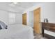 Bright bedroom featuring wood-look floors and closet doors at 129 94Th Ave, Treasure Island, FL 33706