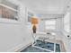 Bright office featuring a white desk, three windows, and a comfortable chair at 129 94Th Ave, Treasure Island, FL 33706
