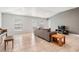 Open living room with vaulted ceilings, tile floors, and lots of natural light at 14916 Imperial Purple Ln, Wimauma, FL 33598