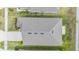Aerial view of a modern roof showcasing its design and the surrounding landscaped yard at 14916 Imperial Purple Ln, Wimauma, FL 33598